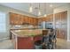 Kitchen boasts granite countertops, stainless appliances, and a convenient breakfast bar with seating at 4497 E Ficus Way, Gilbert, AZ 85298
