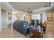 Open-concept living room showcasing a large sectional sofa and seamless transition to the entry hall at 4497 E Ficus Way, Gilbert, AZ 85298