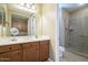 Bright main bathroom boasts vanity with sink, and a tiled walk-in shower at 4497 E Ficus Way, Gilbert, AZ 85298