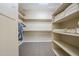 Walk-in closet with plenty of storage and shelving at 4497 E Ficus Way, Gilbert, AZ 85298