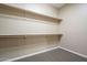 Unfinished walk-in closet with plentiful shelving space at 4497 E Ficus Way, Gilbert, AZ 85298