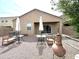 Backyard with gravel, patio seating, and a fire pit at 4774 E Chromium Rd, San Tan Valley, AZ 85143