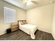 Bedroom featuring wood floors, a closet, and a bed with a headboard at 4774 E Chromium Rd, San Tan Valley, AZ 85143