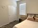 Bedroom featuring wood floors, a closet, and a bed with a headboard at 4774 E Chromium Rd, San Tan Valley, AZ 85143