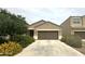 Charming single-level home features a neutral stucco exterior, two-car garage, and well-maintained landscaping at 4774 E Chromium Rd, San Tan Valley, AZ 85143