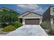 Charming single-story home with a desert landscaped front yard and a two-car garage at 4774 E Chromium Rd, San Tan Valley, AZ 85143