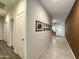 Hallway features tile flooring, fresh paint, and decorative picture frames at 4774 E Chromium Rd, San Tan Valley, AZ 85143