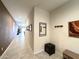 Spacious hallway features tile flooring, fresh paint, and modern decor at 4774 E Chromium Rd, San Tan Valley, AZ 85143