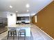Bright kitchen with granite countertops, stainless steel appliances, and a breakfast bar with seating at 4774 E Chromium Rd, San Tan Valley, AZ 85143