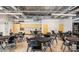 Spacious meeting room with tables, chairs, kitchenette, and ample lighting for community gatherings and events at 4774 E Chromium Rd, San Tan Valley, AZ 85143
