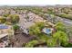 An elevated view of a landscaped backyard and a home with mountain views at 5042 W Lariat Ln, Phoenix, AZ 85083