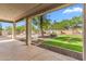 Covered patio with a view of the pool and landscaped backyard at 5042 W Lariat Ln, Phoenix, AZ 85083