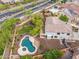 Aerial view of a backyard, highlighting the lush landscaping, patio, and private pool with a spa at 5042 W Lariat Ln, Phoenix, AZ 85083