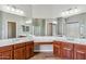 Bathroom featuring dual vanities, granite countertops, ceramic tile flooring, and a makeup vanity at 5042 W Lariat Ln, Phoenix, AZ 85083