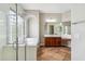 Bathroom with granite counters, dual vanity, tile floors, walk-in shower and glass block window for privacy at 5042 W Lariat Ln, Phoenix, AZ 85083