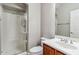 Bathroom featuring a stand-up shower and wooden vanity with chrome fixtures at 5042 W Lariat Ln, Phoenix, AZ 85083