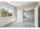 Well-lit bedroom showcasing plush carpet, neutral tones and an open doorway at 5042 W Lariat Ln, Phoenix, AZ 85083