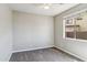 Cozy bedroom with neutral walls, plush carpeting and a bright window at 5042 W Lariat Ln, Phoenix, AZ 85083
