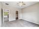 Neutral bedroom with carpet, ceiling fan, walk-in closet, and doorway to another room at 5042 W Lariat Ln, Phoenix, AZ 85083