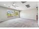 Bright bedroom featuring large windows, plush carpeting and natural lighting at 5042 W Lariat Ln, Phoenix, AZ 85083