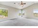 Sunny bedroom with plush carpeting and bright, airy windows at 5042 W Lariat Ln, Phoenix, AZ 85083