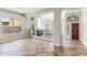 Welcoming entryway features tile flooring, clerestory windows, and wood door at 5042 W Lariat Ln, Phoenix, AZ 85083