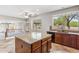 Stylish kitchen includes island, granite counters, and backyard views at 5042 W Lariat Ln, Phoenix, AZ 85083