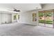 Spacious living room with multiple windows and sliding glass door to yard at 5042 W Lariat Ln, Phoenix, AZ 85083