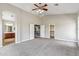 Spacious main bedroom with vaulted ceilings, neutral walls, gray carpet, and walk-in closet at 5042 W Lariat Ln, Phoenix, AZ 85083