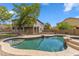 Backyard features an in-ground pool with a spa, all enclosed by a secure fence at 5042 W Lariat Ln, Phoenix, AZ 85083