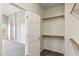 Walk-in closet with wood racks and shelves for optimal storage at 5042 W Lariat Ln, Phoenix, AZ 85083