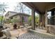 Serene backyard with desert landscaping, patio, and outdoor seating areas at 5118 S Morning Sky Trl, Gold Canyon, AZ 85118