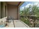 Balcony with seating offers serene views of the neighborhood landscape and lush greenery at 5118 S Morning Sky Trl, Gold Canyon, AZ 85118