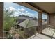 Balcony with seating area and a view of a nearby house, landscaped yard, and mountains at 5118 S Morning Sky Trl, Gold Canyon, AZ 85118