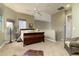 Bedroom showcasing carpet, tan walls, wooden furniture, and a ceiling fan at 5118 S Morning Sky Trl, Gold Canyon, AZ 85118