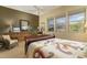 Bedroom boasting natural light with mountain views, a ceiling fan, and comfortable furnishings at 5118 S Morning Sky Trl, Gold Canyon, AZ 85118