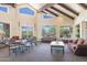 Community gathering area with soaring ceilings, exposed beams, and abundant natural light at 5118 S Morning Sky Trl, Gold Canyon, AZ 85118