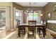 Cozy dining room with a wooden table, natural light, and views of the backyard at 5118 S Morning Sky Trl, Gold Canyon, AZ 85118