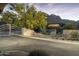 Community entrance gate with desert landscaping and mountain views in the background at 5118 S Morning Sky Trl, Gold Canyon, AZ 85118