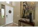 Inviting entryway featuring a neutral color palette, decorative accents, and tiled flooring at 5118 S Morning Sky Trl, Gold Canyon, AZ 85118
