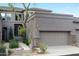 Inviting home with a two-car garage, desert landscaping, and a mix of stone and stucco exterior at 5118 S Morning Sky Trl, Gold Canyon, AZ 85118