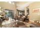 Spacious living room featuring hardwood floors, leather seating, and an open floor plan at 5118 S Morning Sky Trl, Gold Canyon, AZ 85118