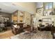Spacious living room featuring hardwood floors, leather seating, and an open floor plan at 5118 S Morning Sky Trl, Gold Canyon, AZ 85118