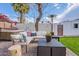 Cozy backyard featuring a hot tub, comfortable lounge area, and lush greenery, creating a private outdoor retreat at 541 W Palm Ln, Phoenix, AZ 85003