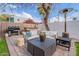 Inviting backyard with brick pavers, outdoor seating, grill, and a relaxing hot tub area, perfect for entertaining at 541 W Palm Ln, Phoenix, AZ 85003