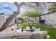 Lush backyard offering a comfortable seating area, a grill, and a shaded dining space, ideal for outdoor gatherings at 541 W Palm Ln, Phoenix, AZ 85003