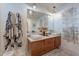 Elegant bathroom featuring double sinks, a modern vanity, and stylish decorative accents at 541 W Palm Ln, Phoenix, AZ 85003
