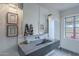 Bright bathroom with concrete sink, floating vanity, and modern tiled wall detail at 541 W Palm Ln, Phoenix, AZ 85003