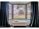 Charming bay window nook featuring a comfortable bench seat and views of the neighborhood at 541 W Palm Ln, Phoenix, AZ 85003