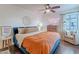 Comfortable bedroom featuring hardwood floors, neon artwork, and sitting area at 541 W Palm Ln, Phoenix, AZ 85003
